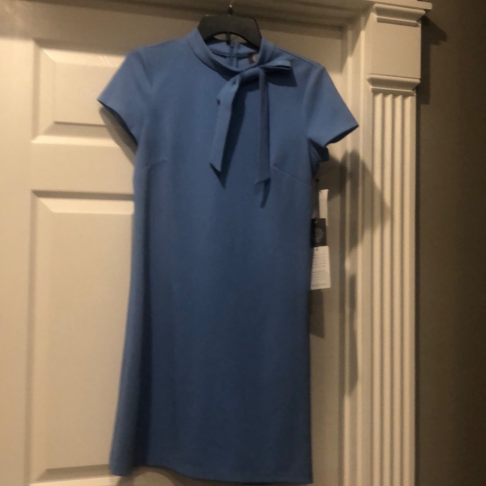 vince camuto blue dress with bow at neckline.